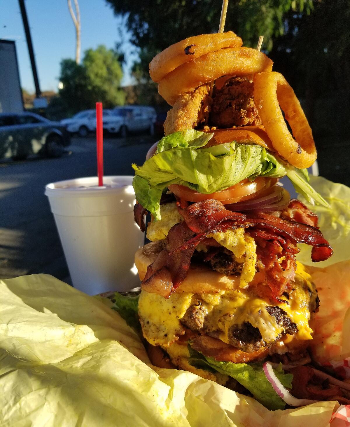 The Leaning Tower of Watts burger at Hawkins House of Burgers