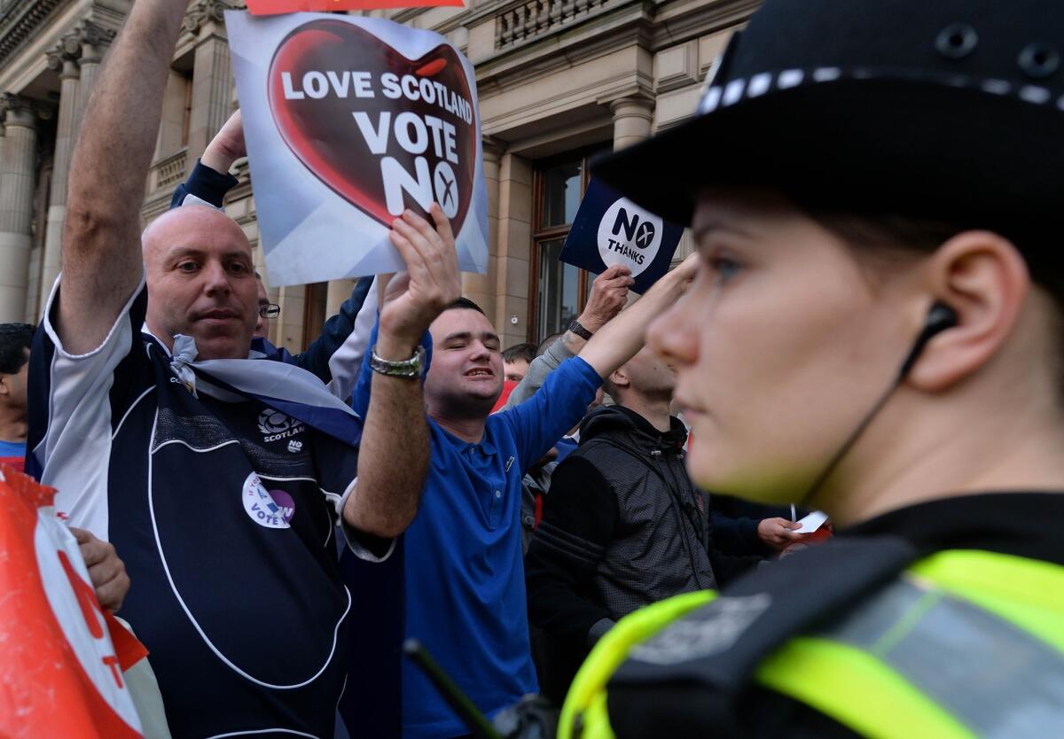 Pro-union demonstrators rally in Glasgow's George Square on the final day of campaigning in the Scottish referendum.
