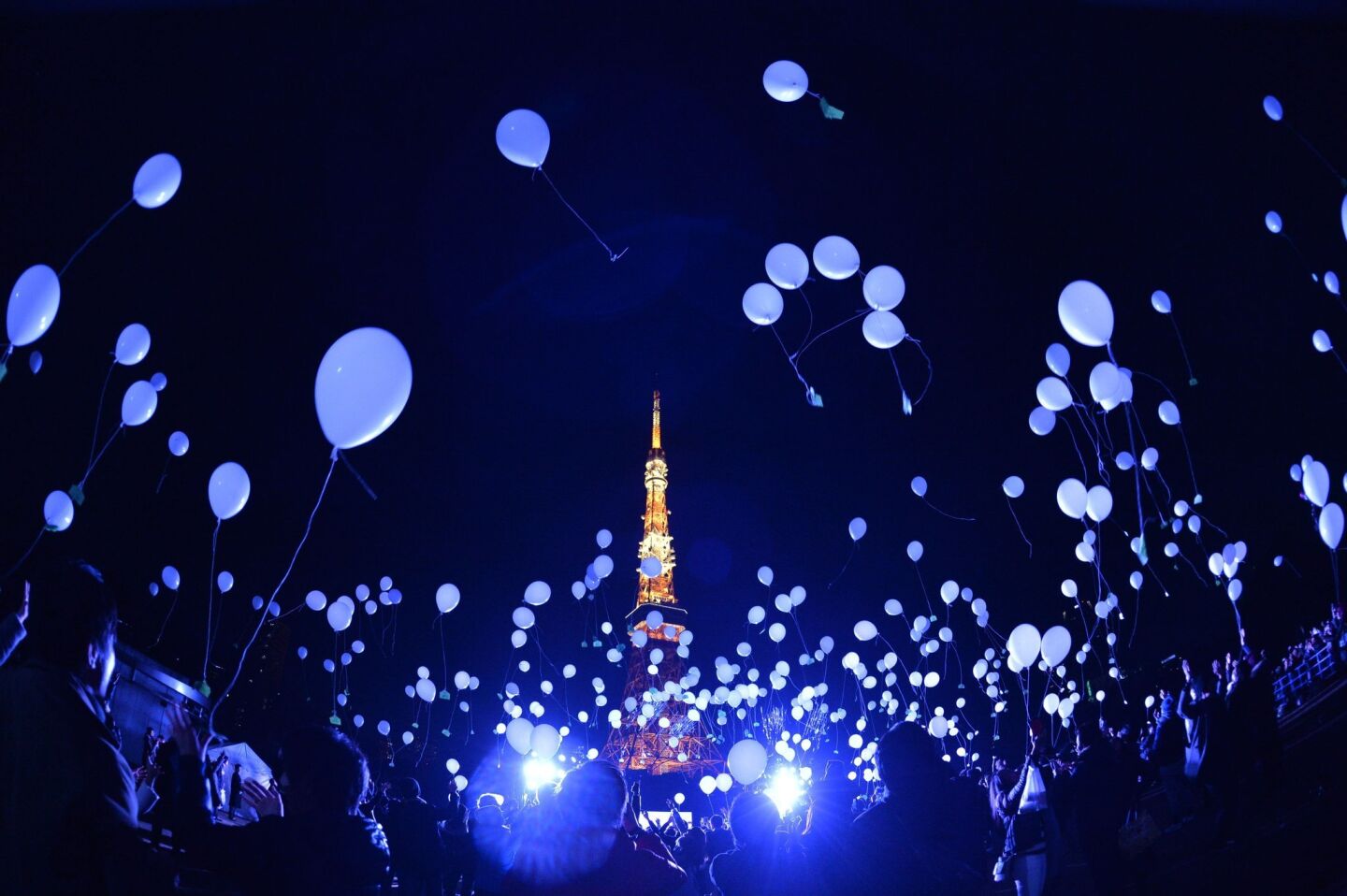 Balloons are released to celebrate the new year at the Prince Park Tower in Tokyo.