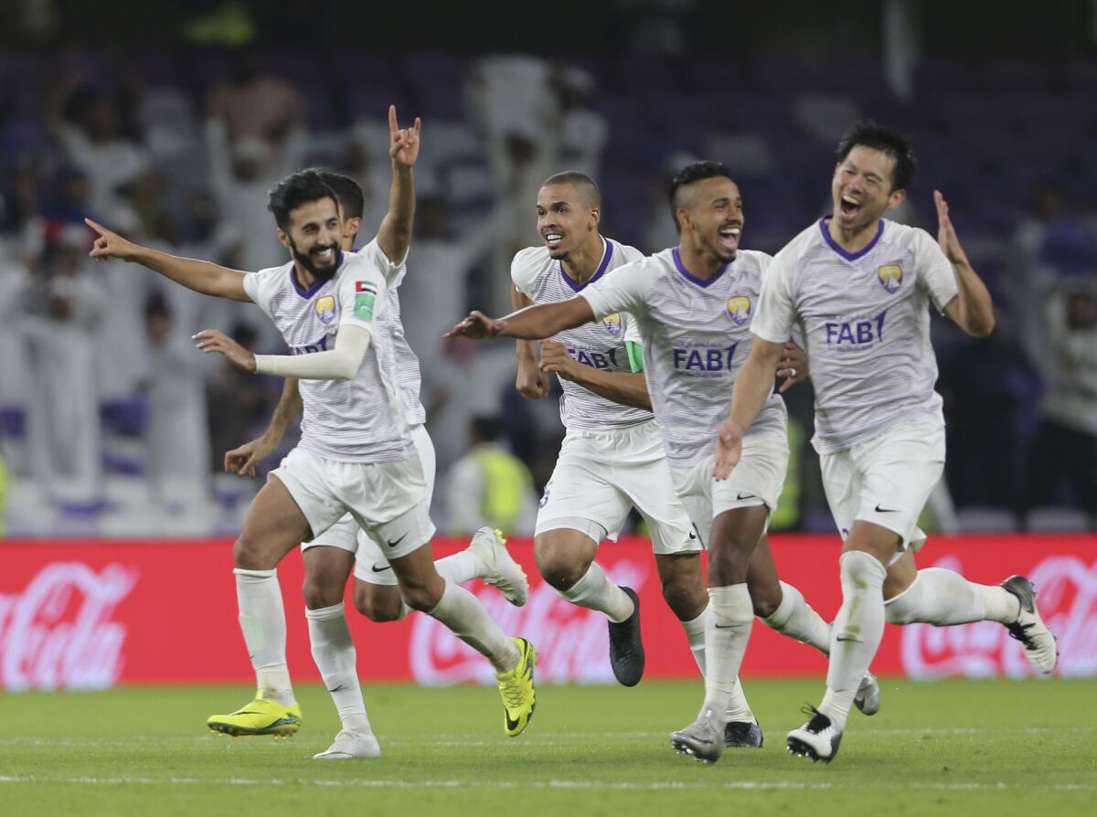 Al Ain players celebrate after winning a penalty shootout during the first round of the Club World Cup soccer match between Al Ain Club and Team Wellington at the Hazza Bin Zayed stadium in Al Ain, United Arab Emirates, Wednesday, Dec. 12, 2018.