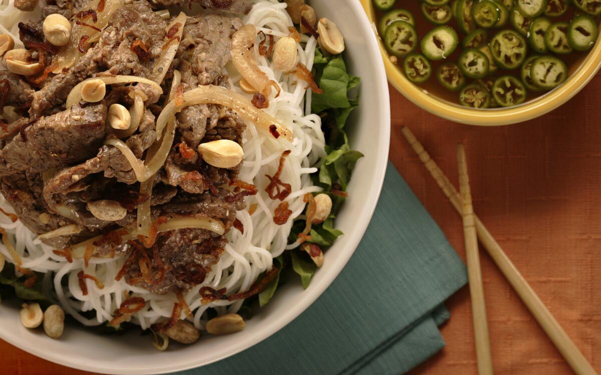 Rice noodle bowl with stir-fried beef (bun thit bo xao)