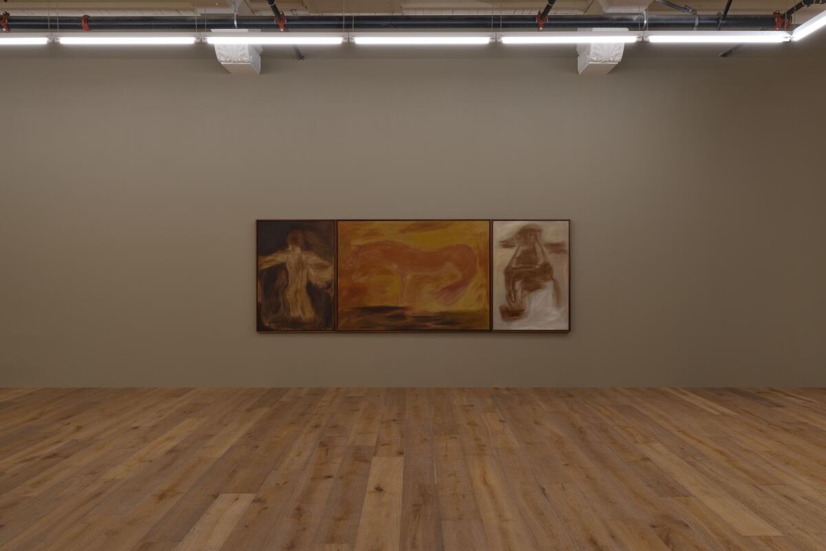 A rectangular painting on a gray gallery wall