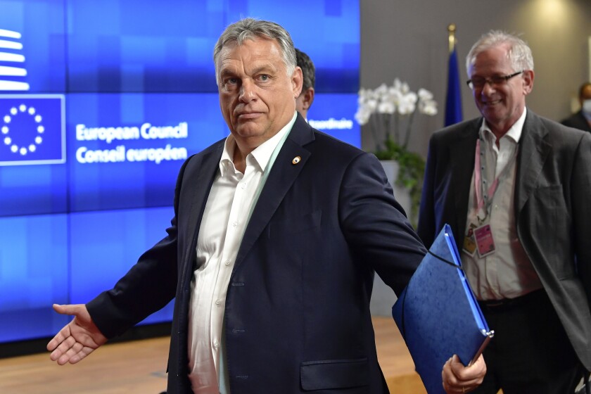 FILE - In this Saturday, July 18, 2020, file photo, Hungary's Prime Minister Viktor Orban gestures at an EU summit in Brussels. Hungary's prime minister says that his country won a “very important battle” at the European Union summit this week, where national leaders of the 27-member bloc decided an seven-year budget and economic recovery package to counter the effects of the coronavirus pandemic. (John Thys, Pool Photo via AP, File)