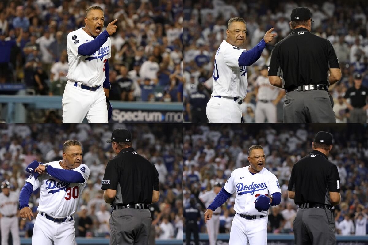 Dodgers manager Dave Roberts argues with first base umpire Ed Hickox.