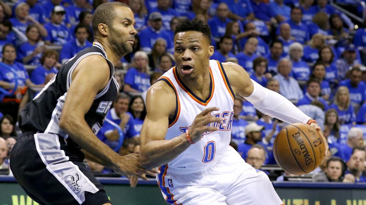 Thunder guard Russell Westbrook (0) drives around Spurs guard Tony Parker during a playoff game this spring.