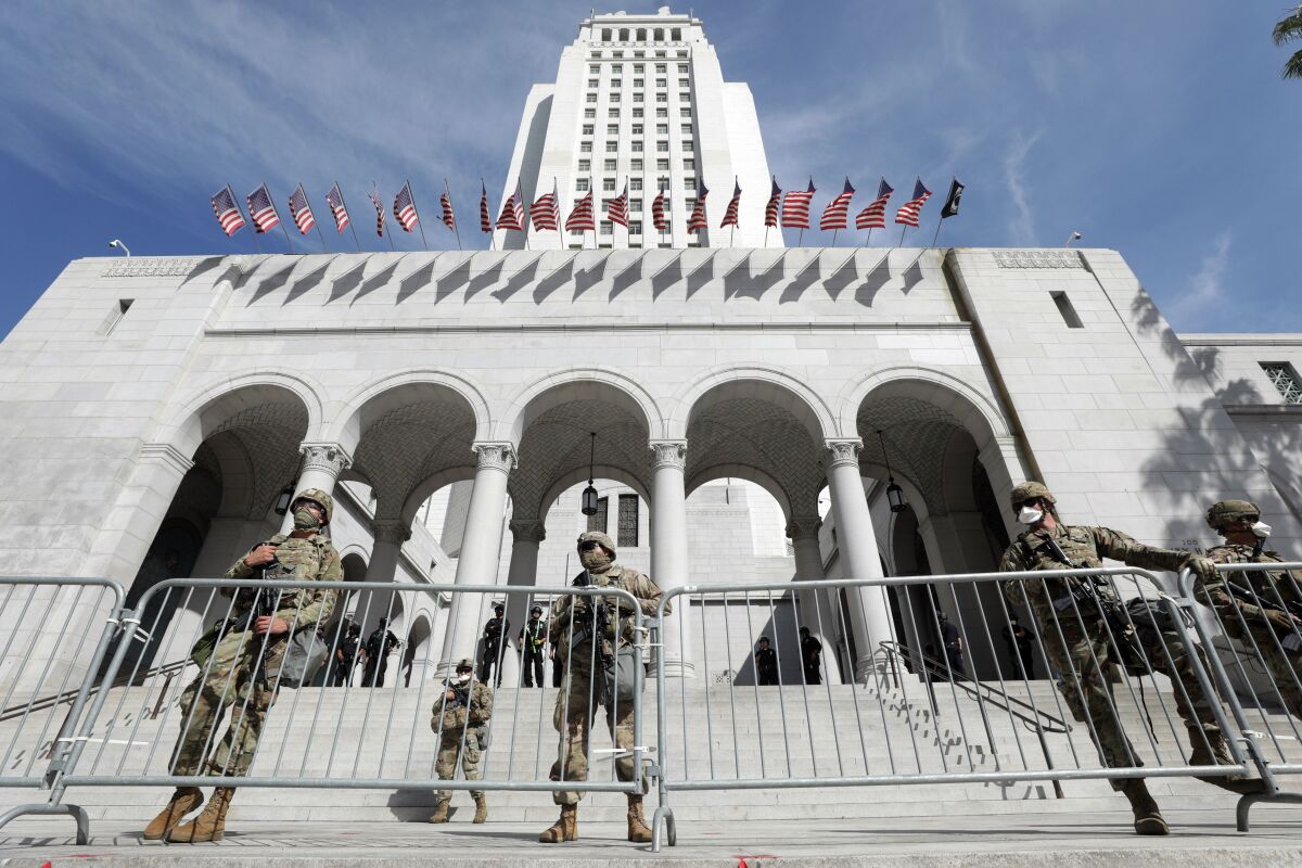 Members of the California National Guard outside Los Angeles City hall on Sunday