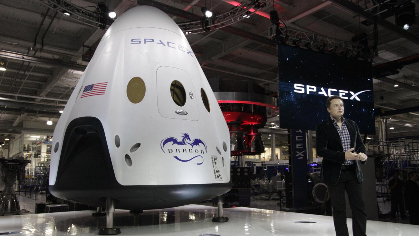 Elon Musk, CEO of SpaceX, introduces the new Dragon V2 spacecraft at SpaceX facilities in Hawthorne on May 29, 2014.