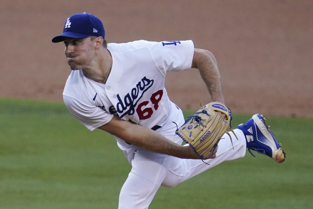 Los Angeles Dodgers starting pitcher Ross Stripling throws to the Seattle Mariners.