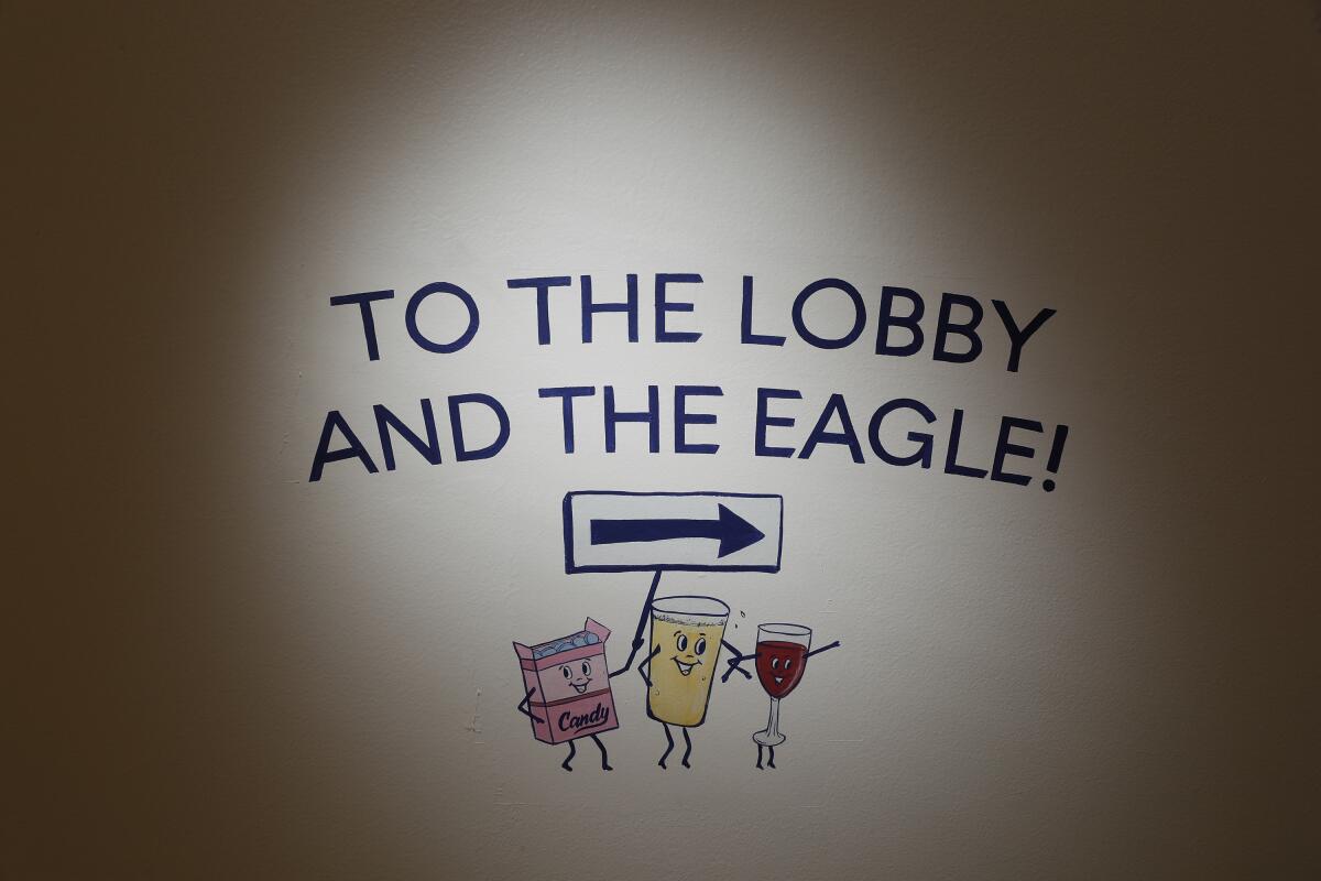 A sign reads "To the lobby and the Eagle."