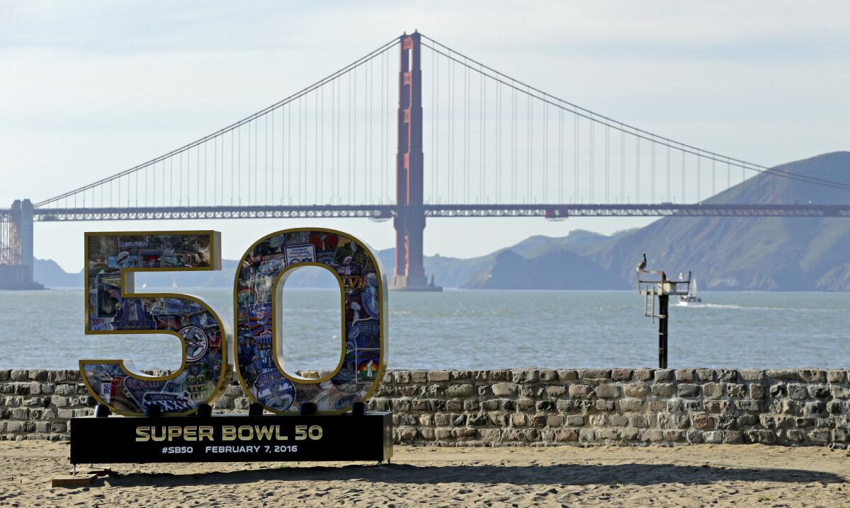 A Super Bowl 50 sign rests on the beach near the Golden Gate Bridge. The FBI and more than 30 other law enforcement agencies rescued seven teens in a Super Bowl sex-trafficking sweep.