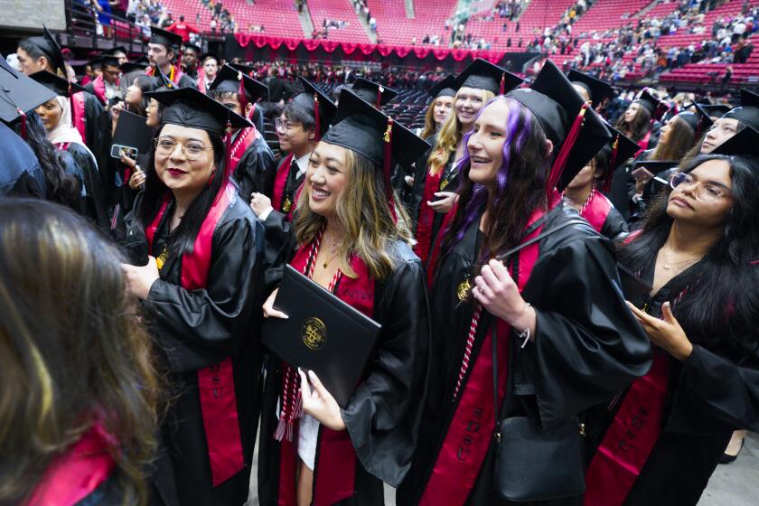 San Diego, CA - May 10: Graduates from the College of Sciences at San Diego State University head out to reconnect with family and friends after the conclusion of their commencement ceremony on Friday, May 10, 2024 in San Diego, CA. (Nelvin C. Cepeda / The San Diego Union-Tribune)