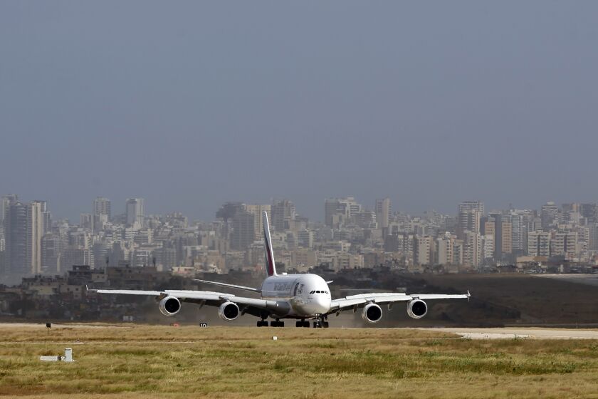 FILE - A double-decker Airbus A380 plane lands at the Rafik Hariri International Airport in Beirut, Lebanon, March 29, 2018. Lebanon's caretaker transportation minister on Thursday, March 30, 2023 said a contract for a new terminal at the country's main airport is cancelled, following criticism that no public bidding was held for the $122 million project. (AP Photo/Bilal Hussein, File)