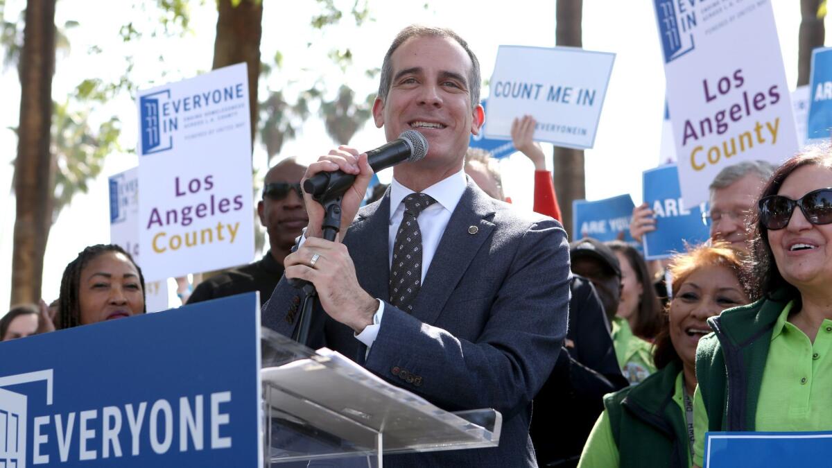 L.A. Mayor Eric Garcetti speaks during the launch of the "Everyone In" campaign in Echo Park on Friday.