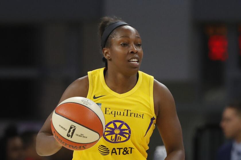Los Angeles Sparks' Chelsea Gray advances the ball during the second half of a WNBA basketball game against the Chicago Sky Friday, Aug. 16, 2019, in Chicago. (AP Photo/Charles Rex Arbogast)