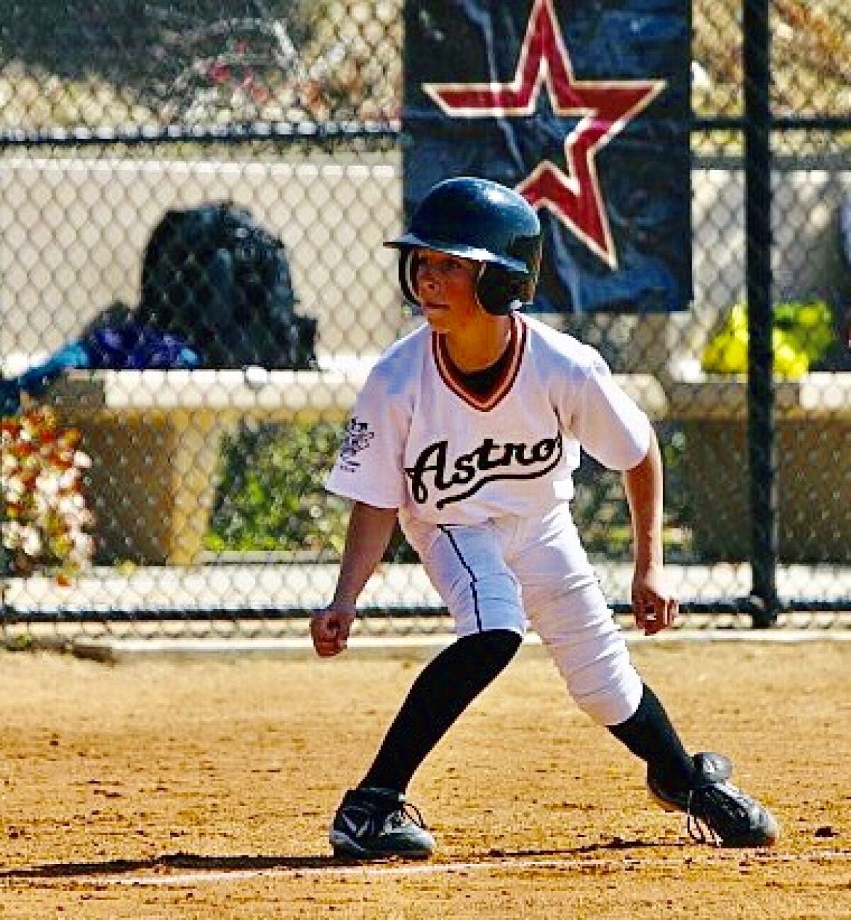 A young Garrett Stubbs playing baseball.