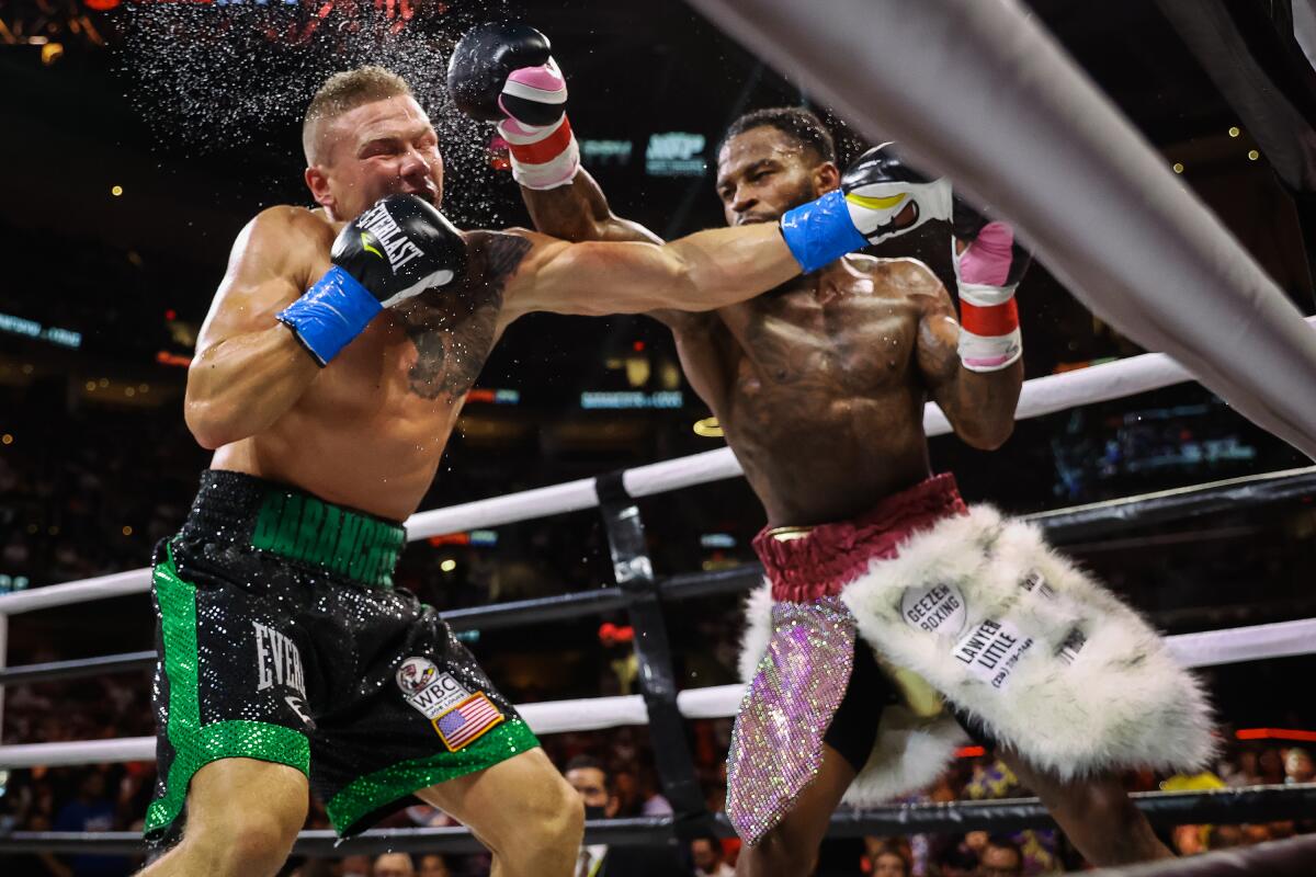 Montana Love, right, punches Ivan Baranchyk during their boxing match Sunday.