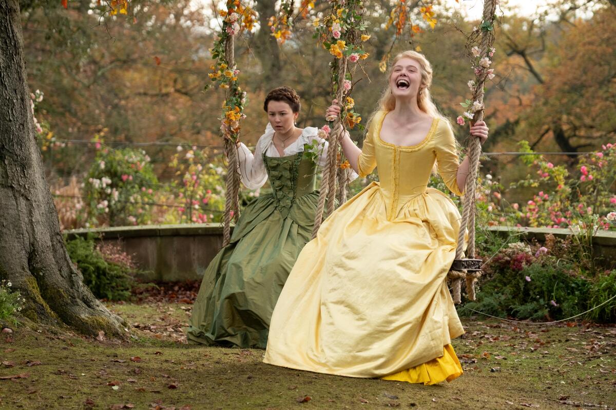 Elle Fanning sits on a swing in Hulu's "The Great."