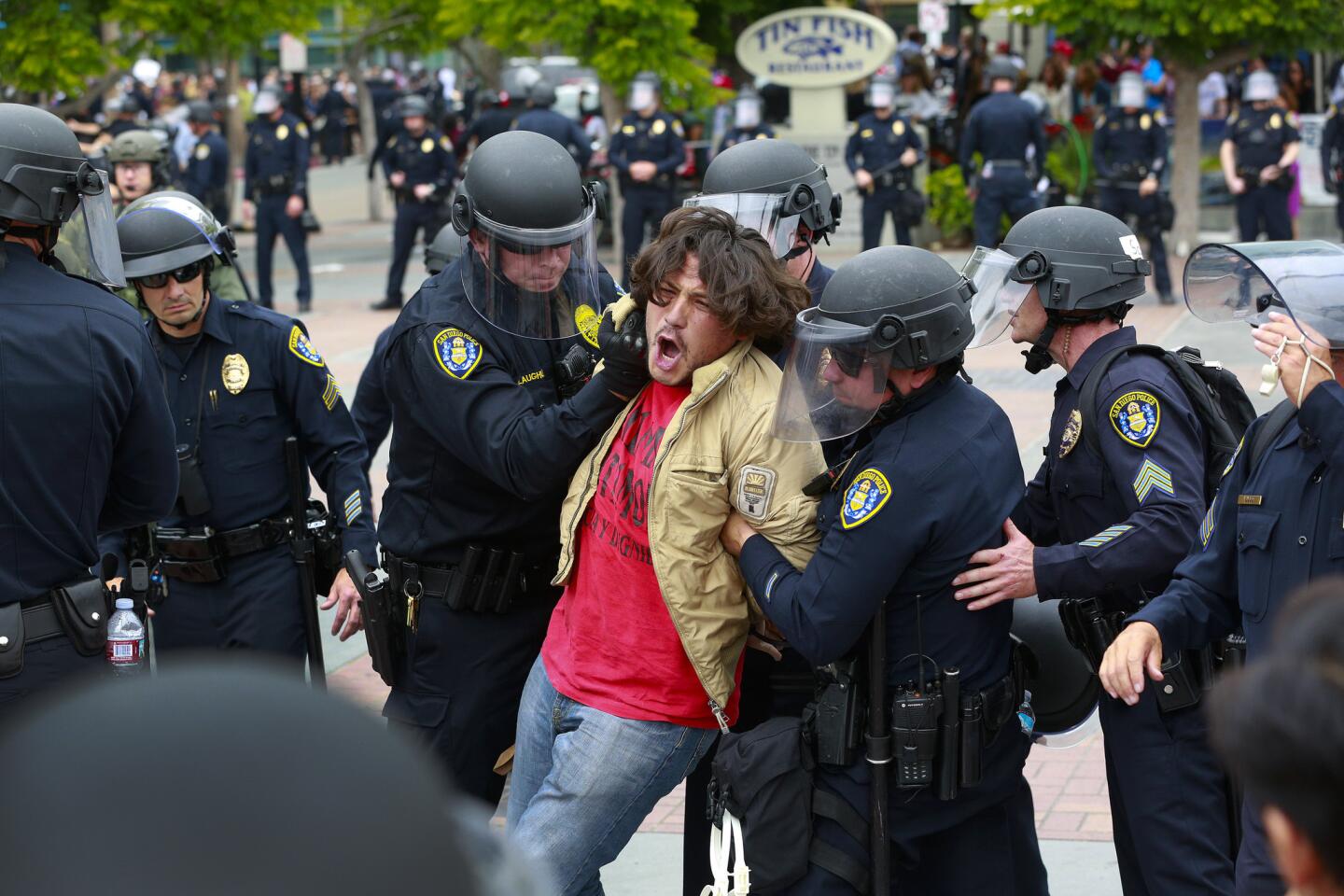 A protester who refused to comply with San Diego police officers in the Gaslamp Quarter was taken into custody on Friday.