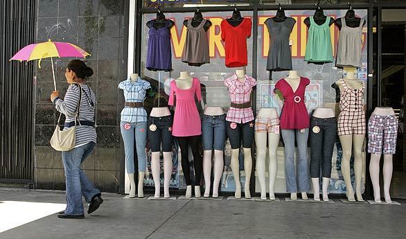 A clothing store does business in one of three old theater buildings along Whittier Boulevard.