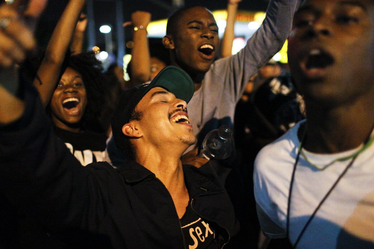 Protesters celebrate after shutting down the 405 Freeway during a Black Lives Matter protest in Inglewood. 