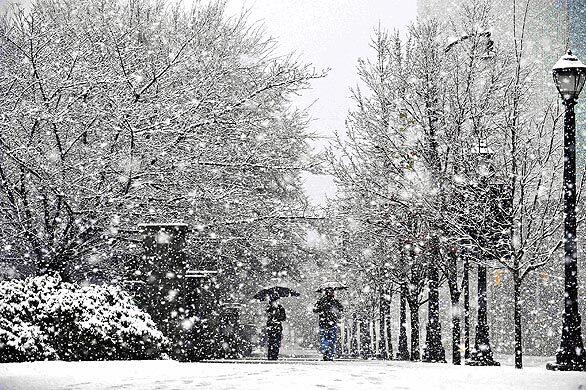 A late-winter snow blankets Centennial Park in Atlanta.
