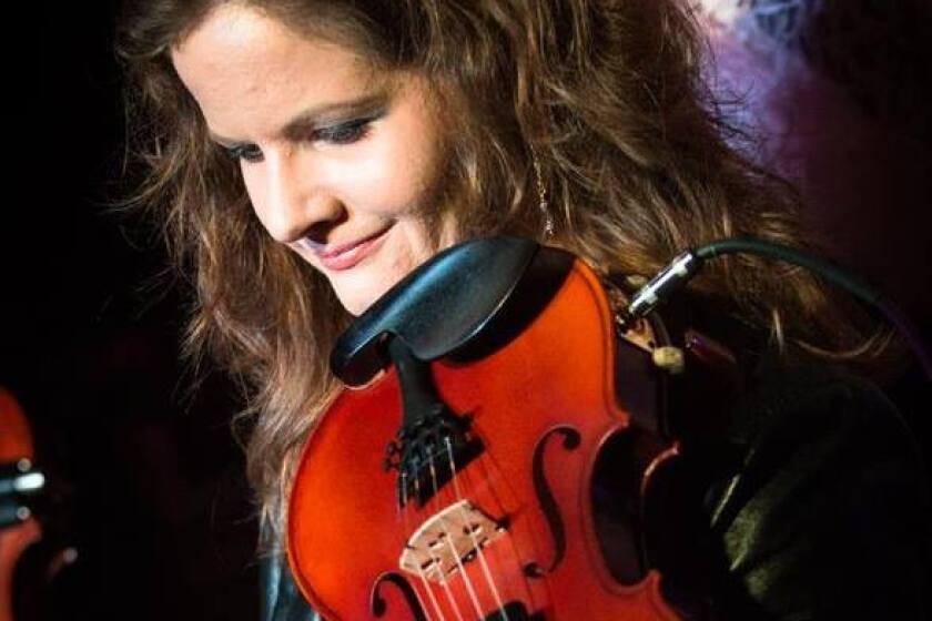 Viola player, Corinne Olsen, lost work due to health and safety concerns during the pandemic