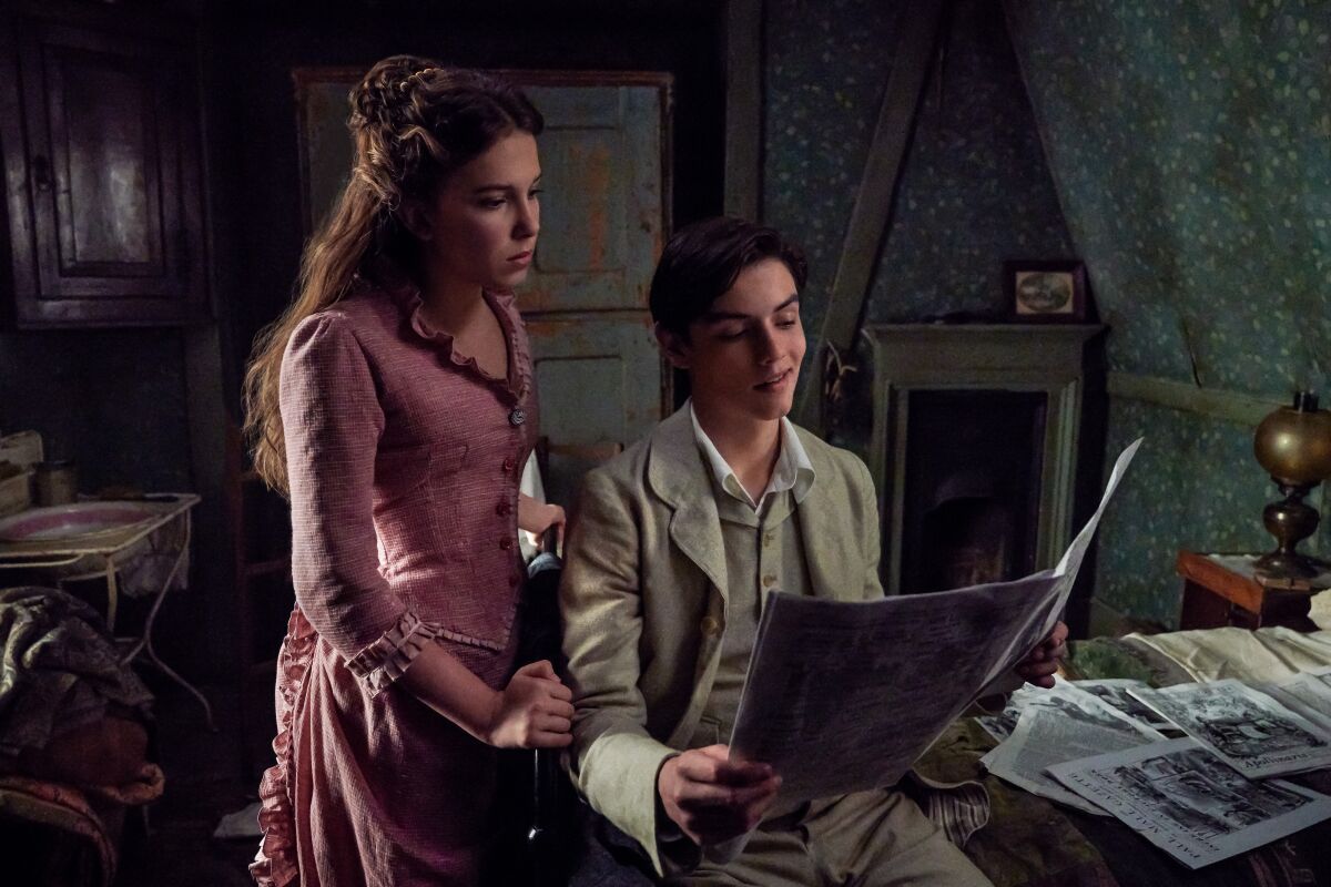 Millie Bobby Brown and Louis Partridge in the movie "Enola Holmes."