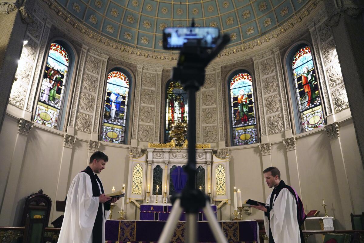 The Rev. Steven Paulikas and curate Spencer Cantrell deliver an Evening Prayer service March 29 on Facebook Live in New York.