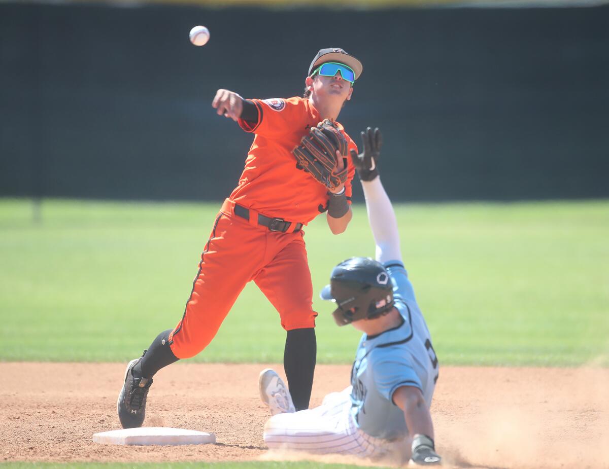 CJ Weinstein (3) of Huntington Beach gets the runner at second, completing a double play.