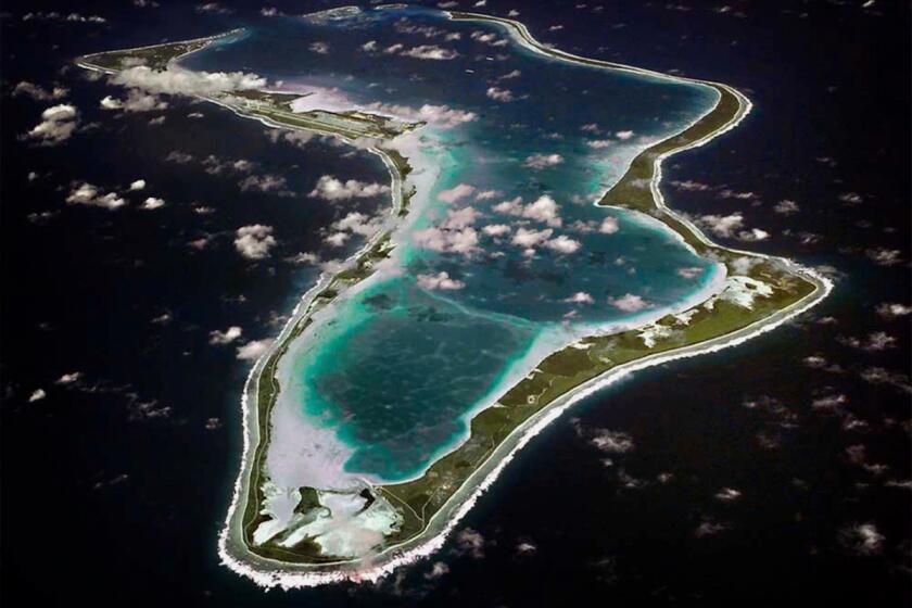 FILE - This image released by the U.S. Navy shows an aerial view of Diego Garcia in the Chagos Island group. (U.S. Navy via AP, File)