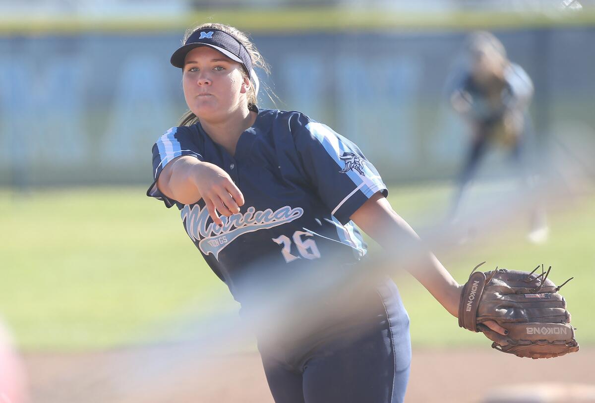 Marina's Emily Rush fires a pitch in a Surf League game against Los Alamitos in Huntington Beach on April 23.