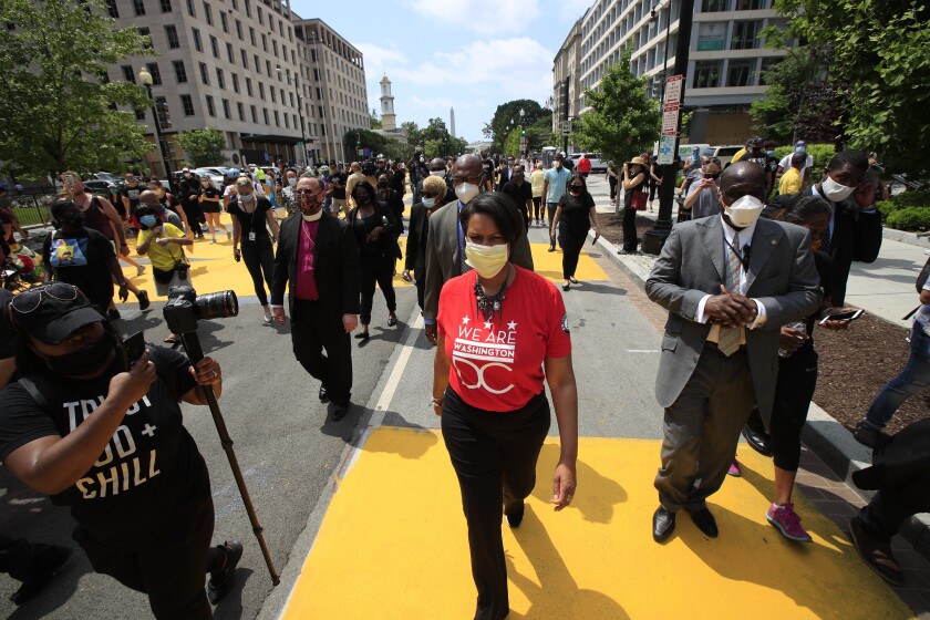 District of Columbia Mayor Muriel Bowser walks on the street leading to the White House
