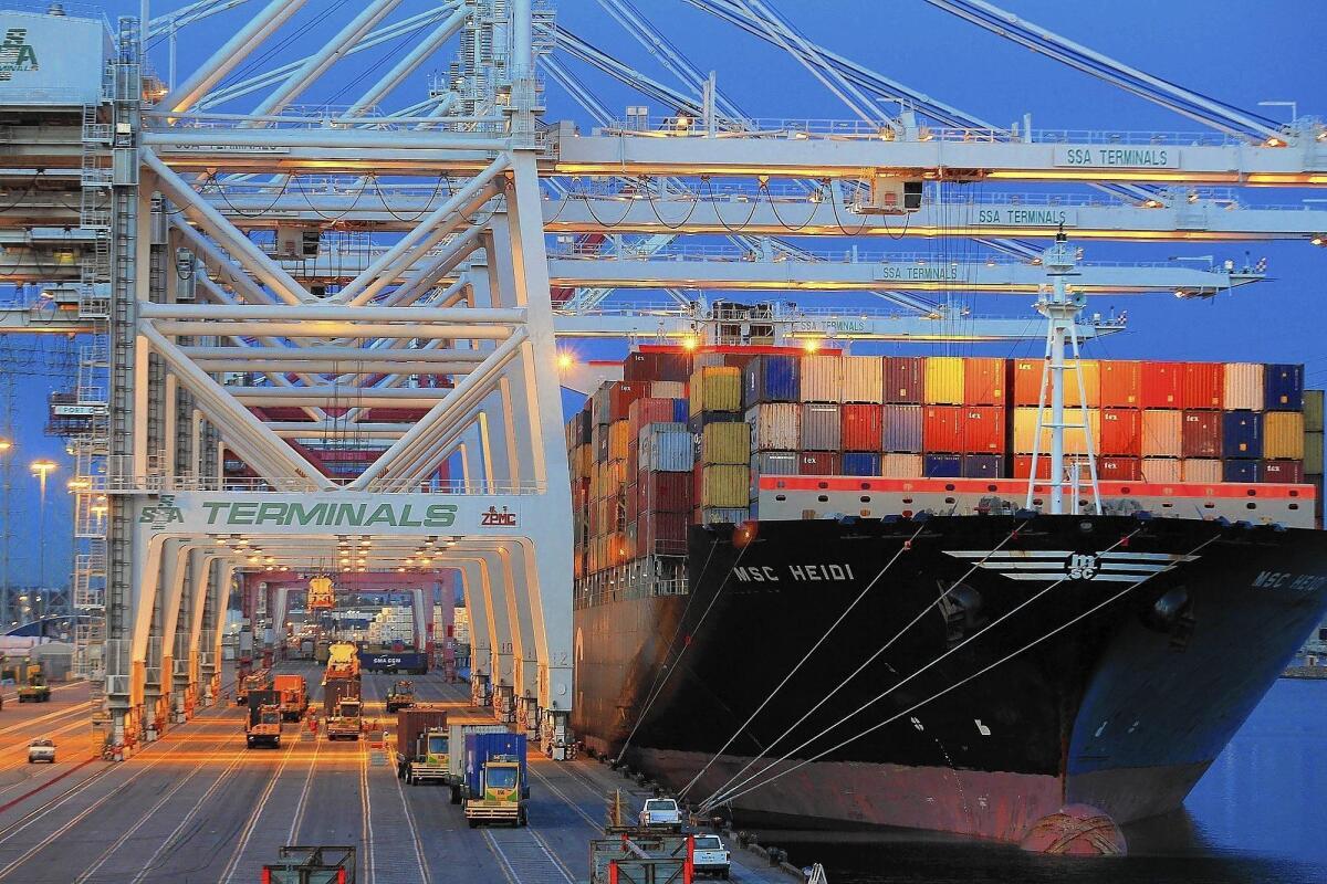 Containers are unloaded from a ship at the Port of Los Angeles. Chinese trade and tourism into the Southland has boomed in recent years, according to an LAEDC study.