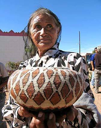 A Seri weaver in the village of Punta Chueca shows a basket she created.