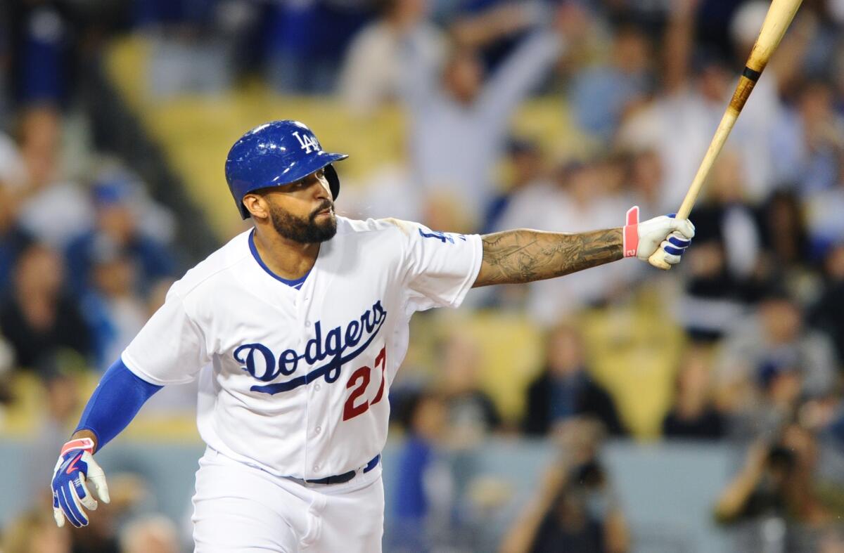 Matt Kemp hits a two-run home run in the first inning off of San Francisco's Madison Bumgarner on Sept. 23.
