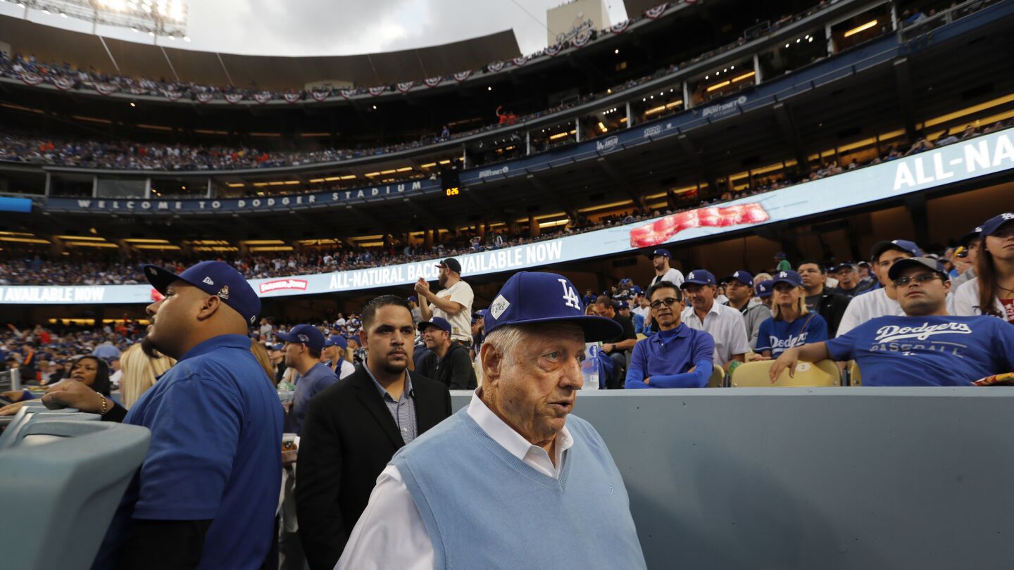 Former Dodgers manager Tommy Lasorda arrives to watch Game 7.