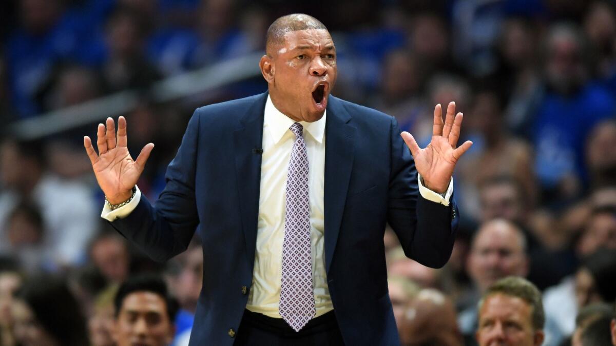 Clippers coach Doc Rivers argues with a referee in Game 6 of the NBA playoffs at Staples Center on Friday.