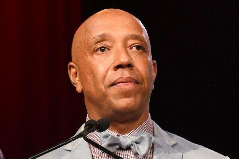 FILE - In this July 18, 2015 file photo, Russell Simmons speaks appears at the RUSH Philanthropic Arts Foundation's Art for Life Benefit in Water Mill, N.Y. Three women have told the New York Times that music mogul Russell Simmons raped them. Simmons, in a statement to the paper, vehemently denied what he called ?€?these horrific accusations,?€? saying all his relations have been consensual. (Photo by Scott Roth/Invision/AP, File)