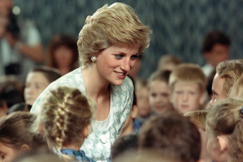 (FILES) This file picture taken 06 November 1989 in Jakarta shows Princess of Wales, Diana, listening to children during her visit to the British international school. Ten years after her death in a Paris tunnel on 31 August 1997, Princess Diana shows no sign of retreating into the shadows -- her most enduring legacy the ability, even now, to engage, capture and divide public opinion. AFP PHOTO/FILES/KRAIPUT PHANVUT TO GO WITH AFP STORY / PACKAGE BRITAIN-ROYALS-DIANA-10YEARS / GB-ROYAUTE-DIANA-10ANS (Photo credit should read KRAIPIT PHANVUT/AFP/Getty Images) ORG XMIT: INDONESI