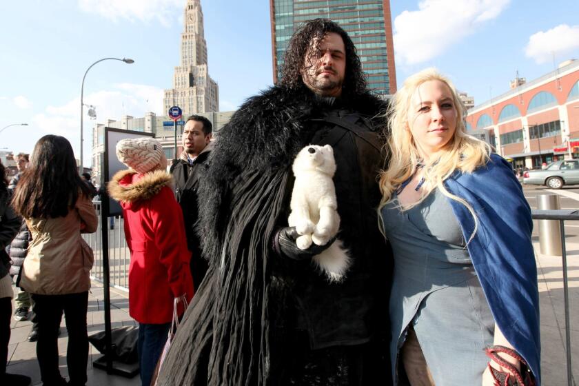 Cosplayers dressed as Jon Snow and Daenerys Targaryen attend the "Game of Thrones" fan experience at Barclays Center in New York.