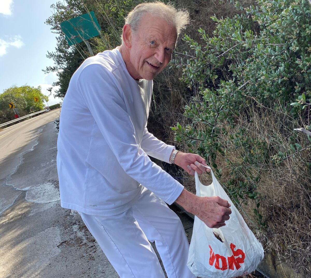 Former San Diego Superintendent Tom Goodman, 90, is neither too self-important nor too old to collect litter five mornings a week from Via Capri.