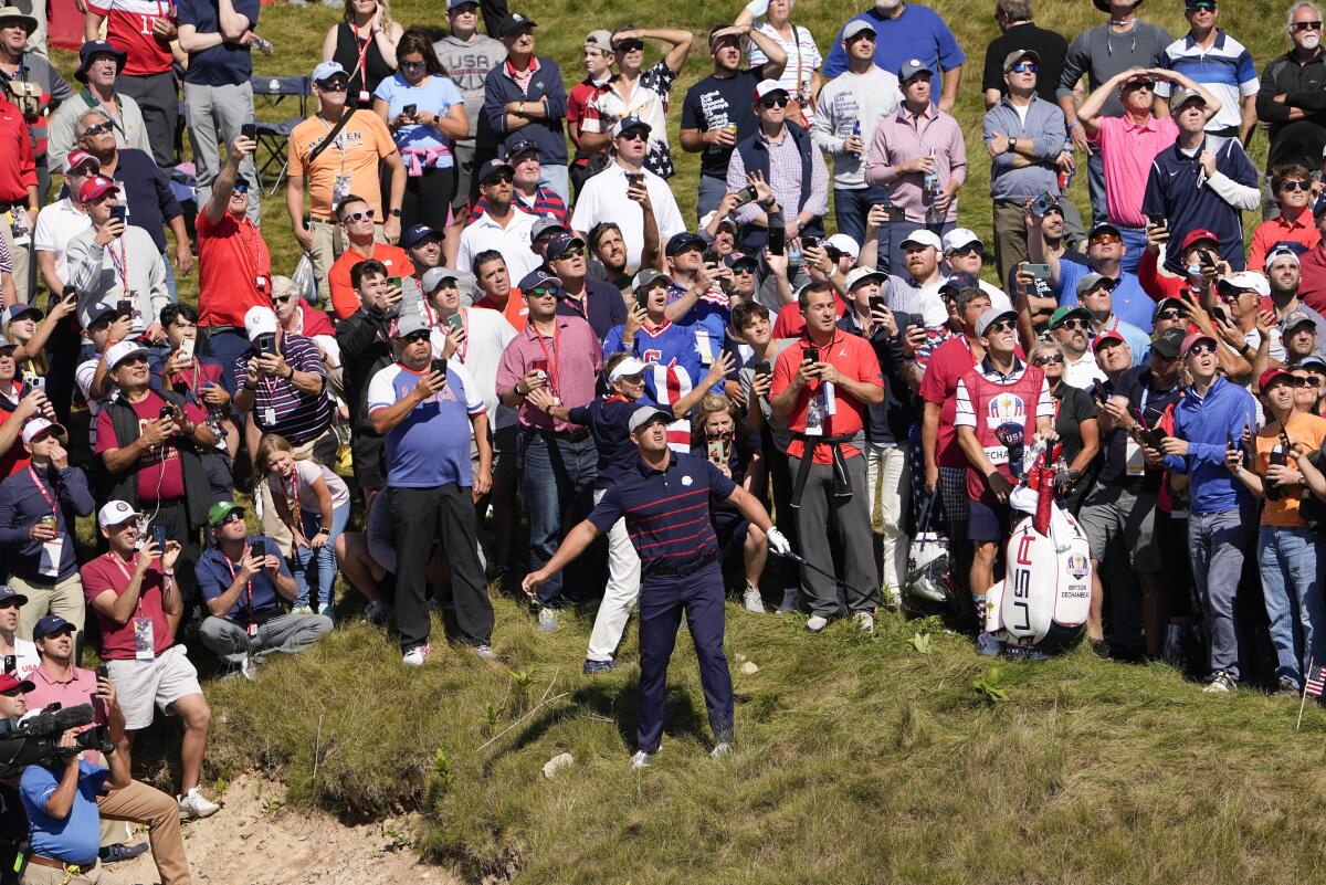 Team USA's Bryson DeChambeau watches his second shot on the first hole during a four-ball match at the Ryder Cup.