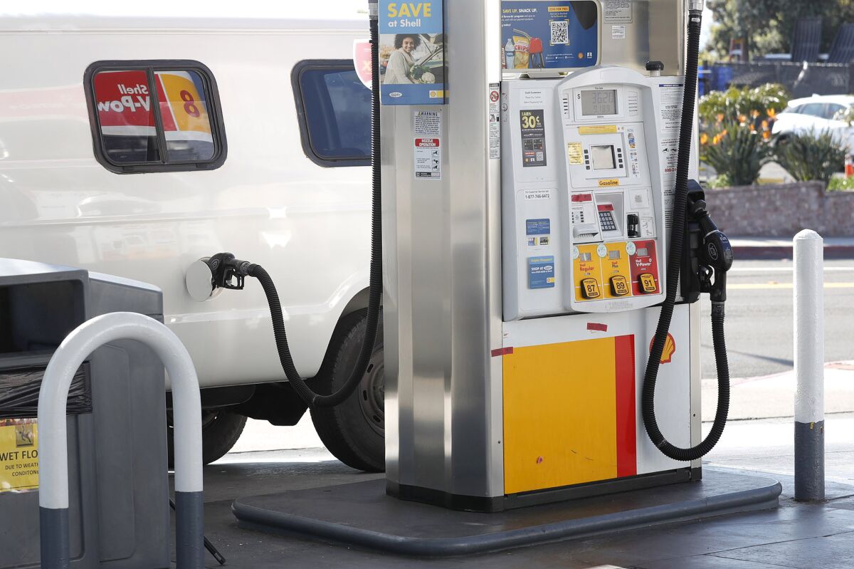 A van is fueled up at a Shell station in Laguna Beach on Monday.