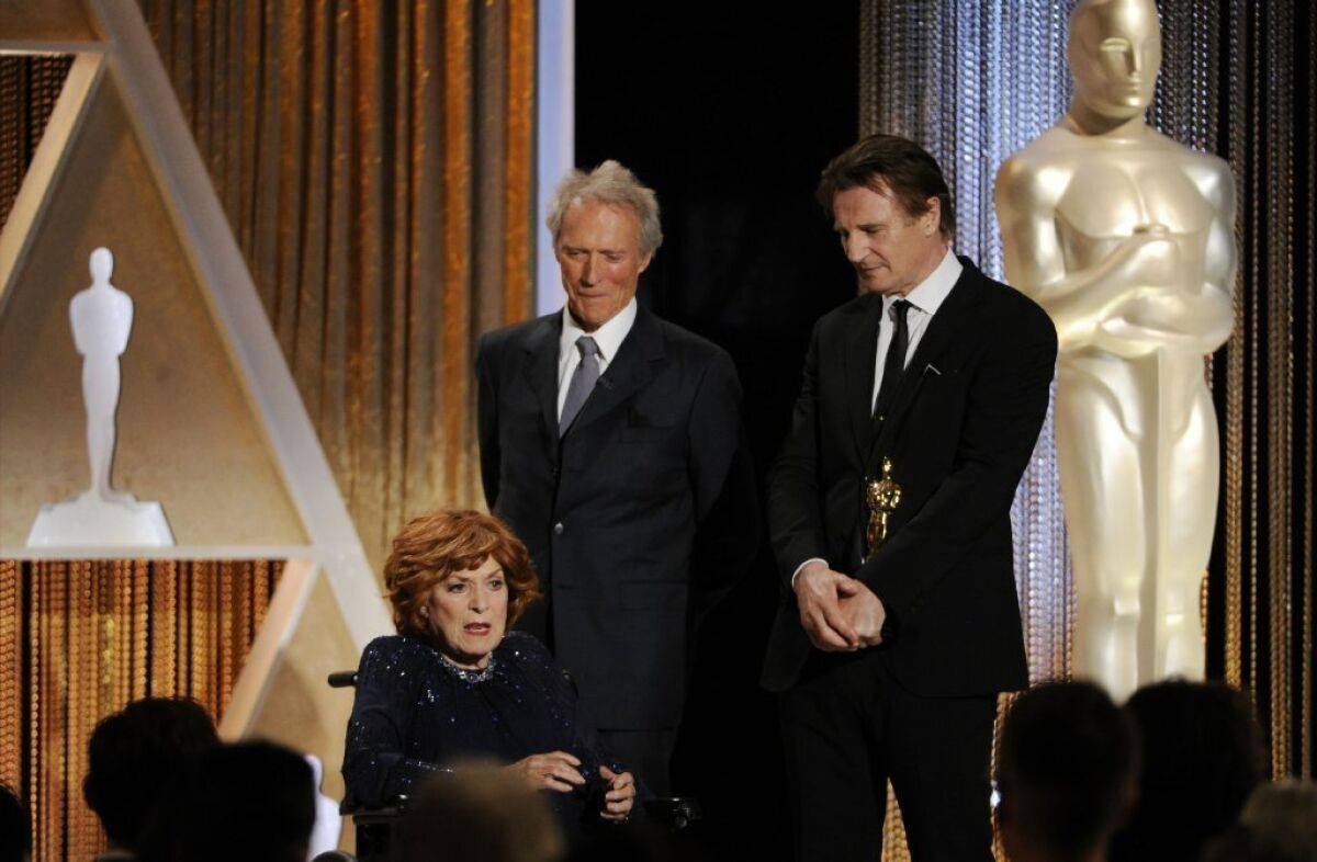 Maureen O'Hara accepts her honorary Oscar from Clint Eastwood and Liam Neeson at the 2014 Governors Awards.