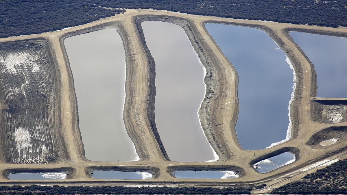 Pits containing production water from oil wells in Kern County.