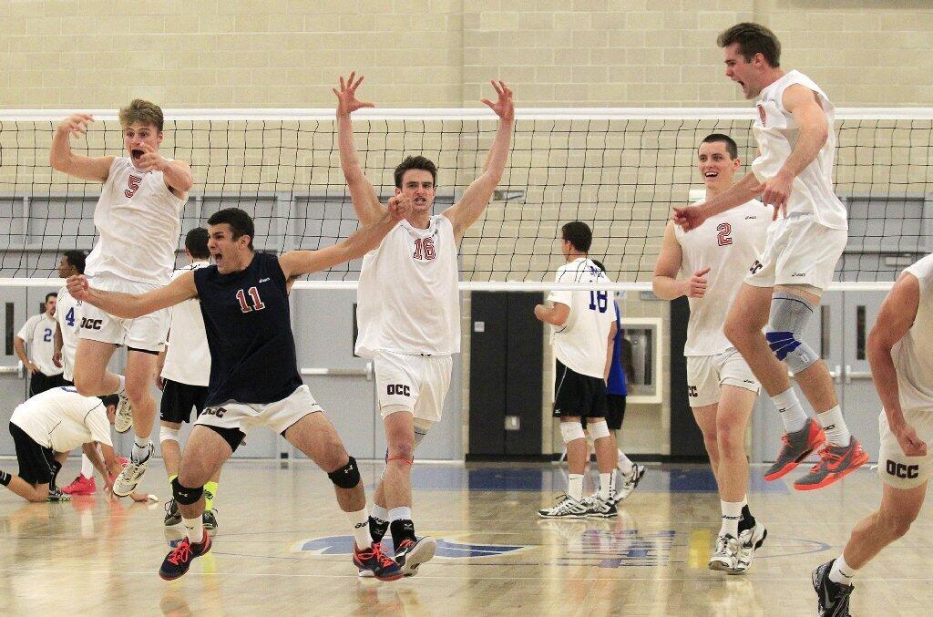 Orange Coast College volleyball players react after beating Santa Monica in the 2014 California Community College Athletic Assn. State Championship match at Santiago Canyon College in Orange on Friday.