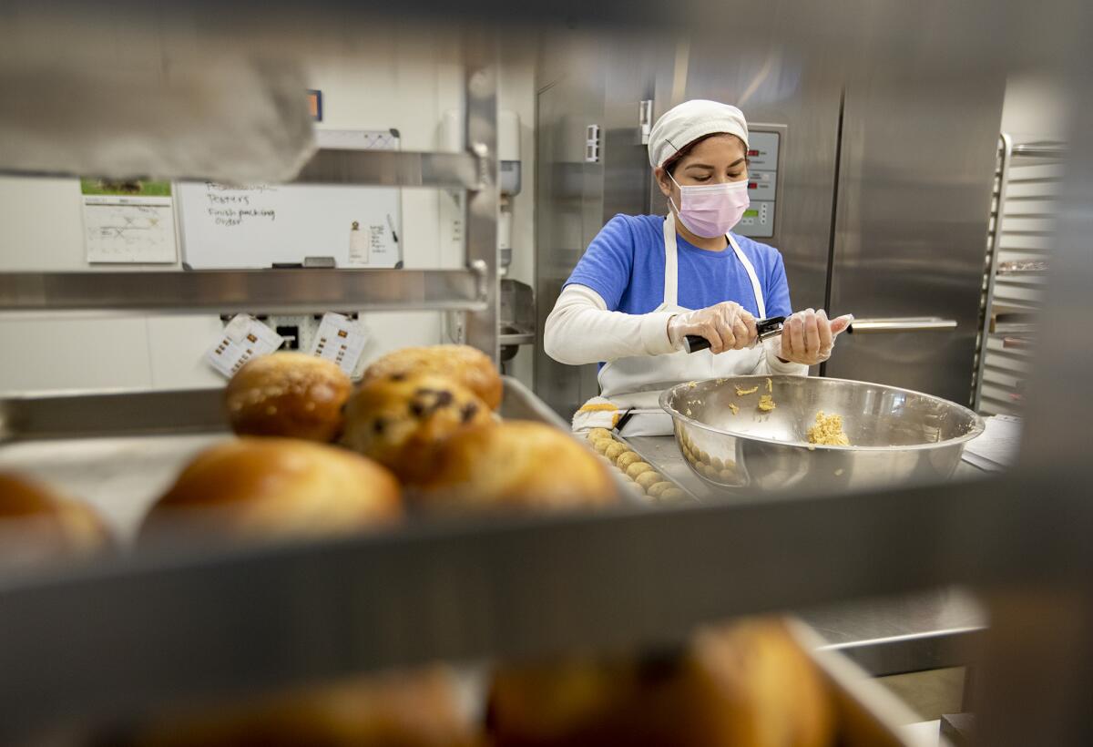 Jennifer De La Cruz makes pecan drops at the kosher Jewish bakery, the Blessed Braid in Irvine.