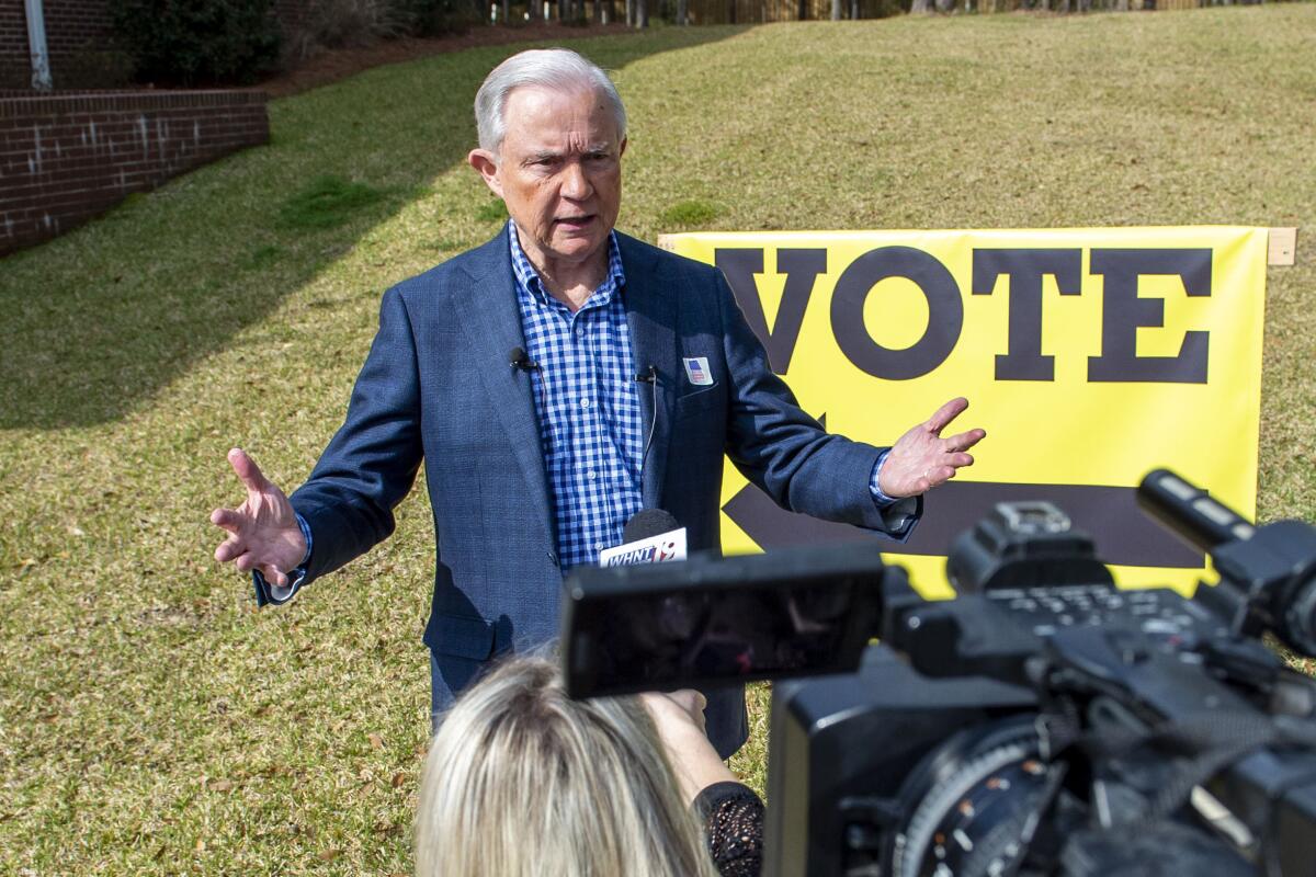 Jeff Sessions talks with the media after voting in Mobile, Ala., on Tuesday.