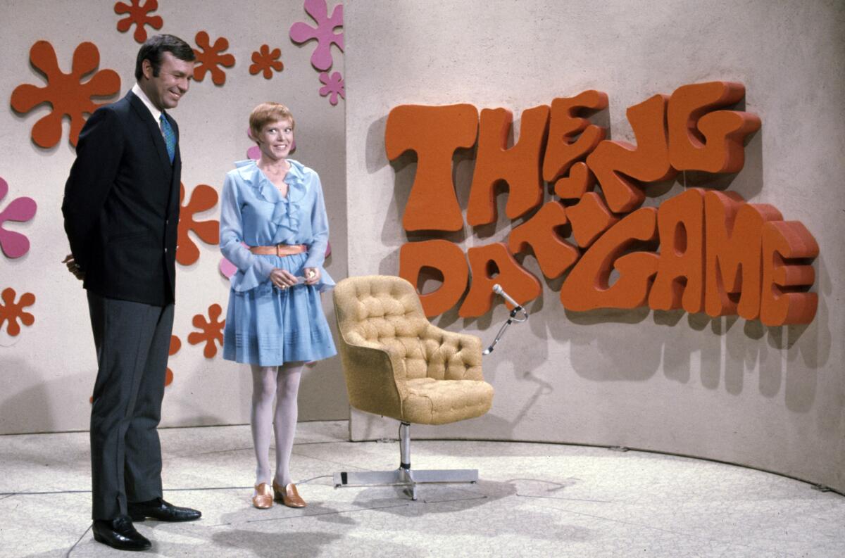 Jim Lange (1932-2014) -- The original and best-known host of "The Dating Game," with a contestant.