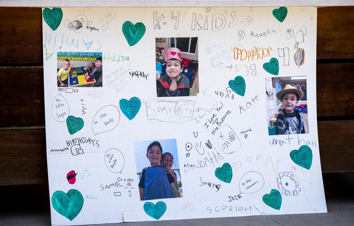A tribute poster hangs outside Calvary Chapel Yorba Linda, where 6-year-old Aiden Leos is remembered.